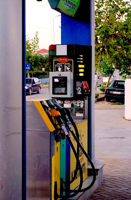 premium gasoline pump nozzle at fuel station