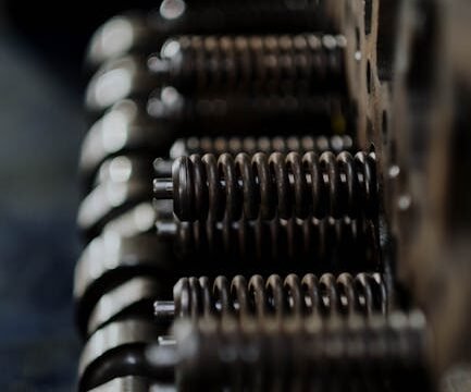 close-up of car engine components showing various mechanical parts