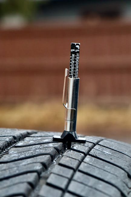 checking tire tread depth for wear and replacement need
