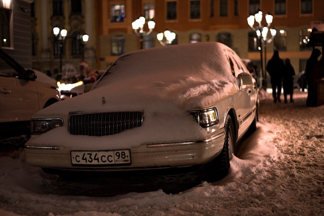Car covered in snow and ice during winter storm