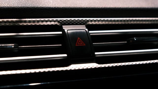 car dashboard with multiple warning lights illuminated