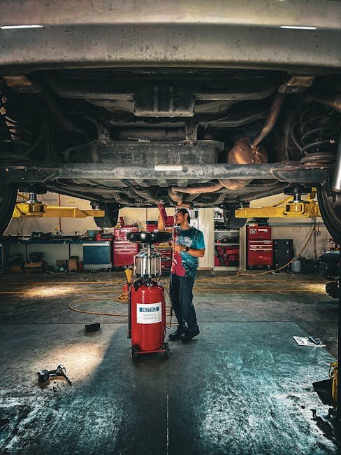 technician inspecting vehicle for warning light cause