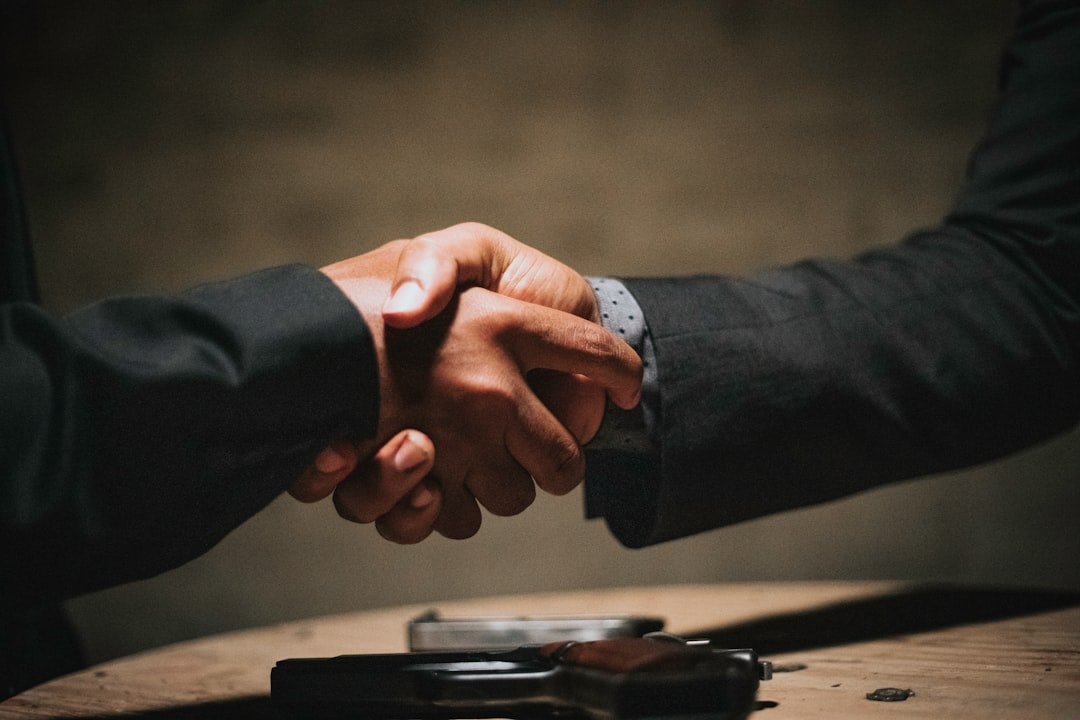 Mechanic shaking hands with customer in trust