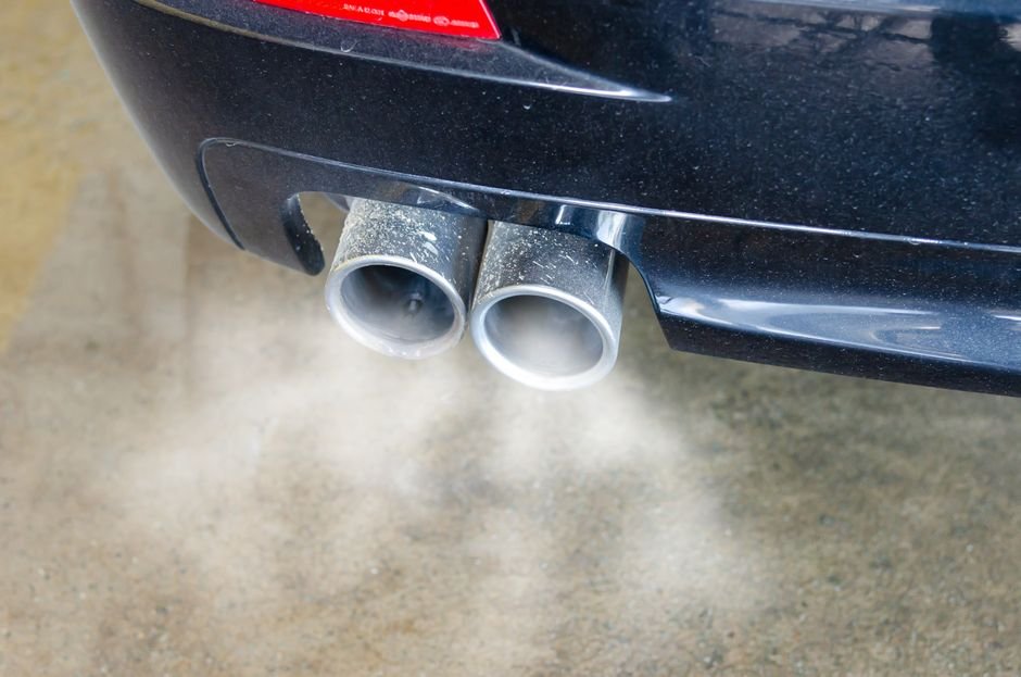 White smoke coming from car exhaust pipe