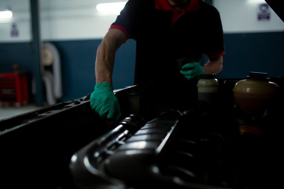 Mechanic installing new oil filter during oil change