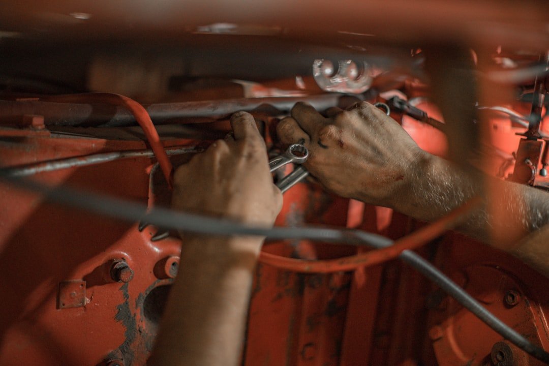 Mechanic testing vehicle electrical and charging system