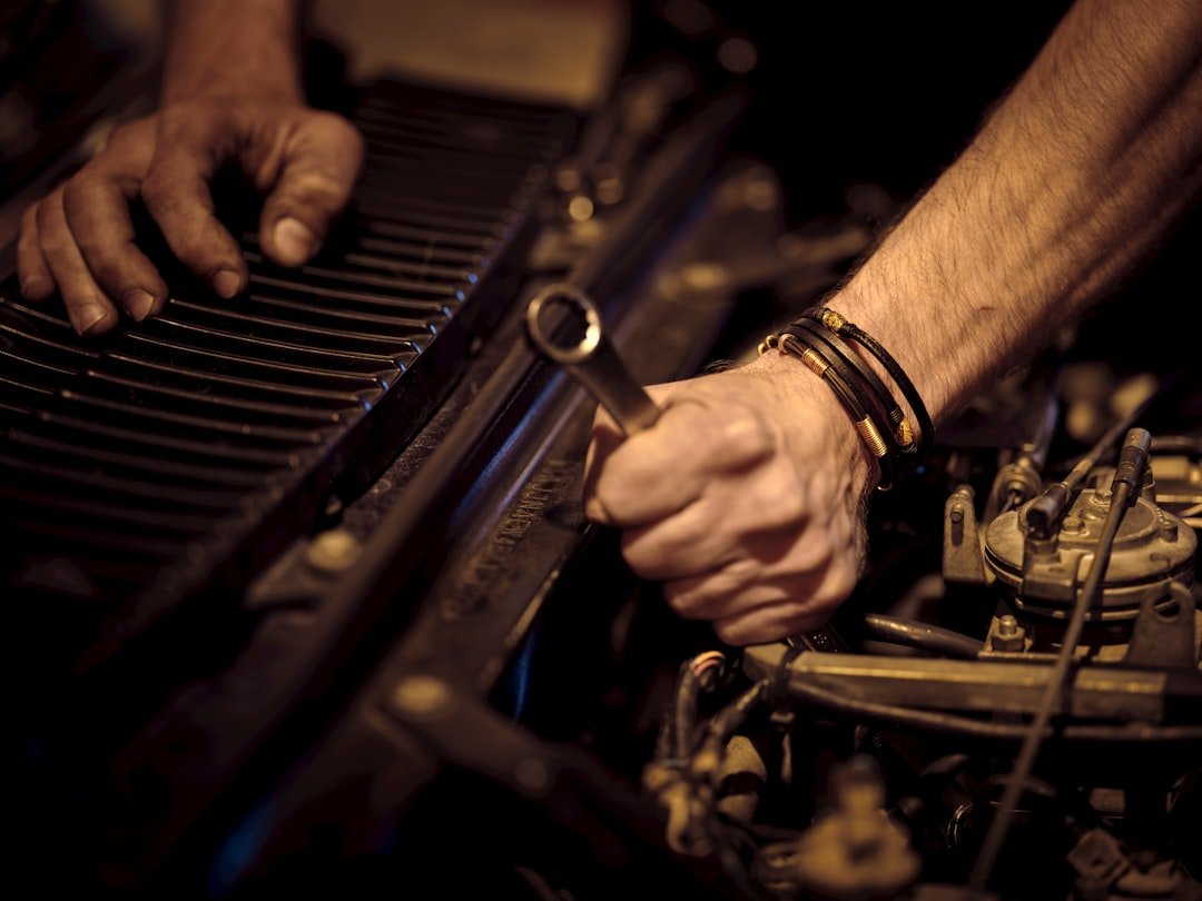 Mechanic servicing fuel system components
