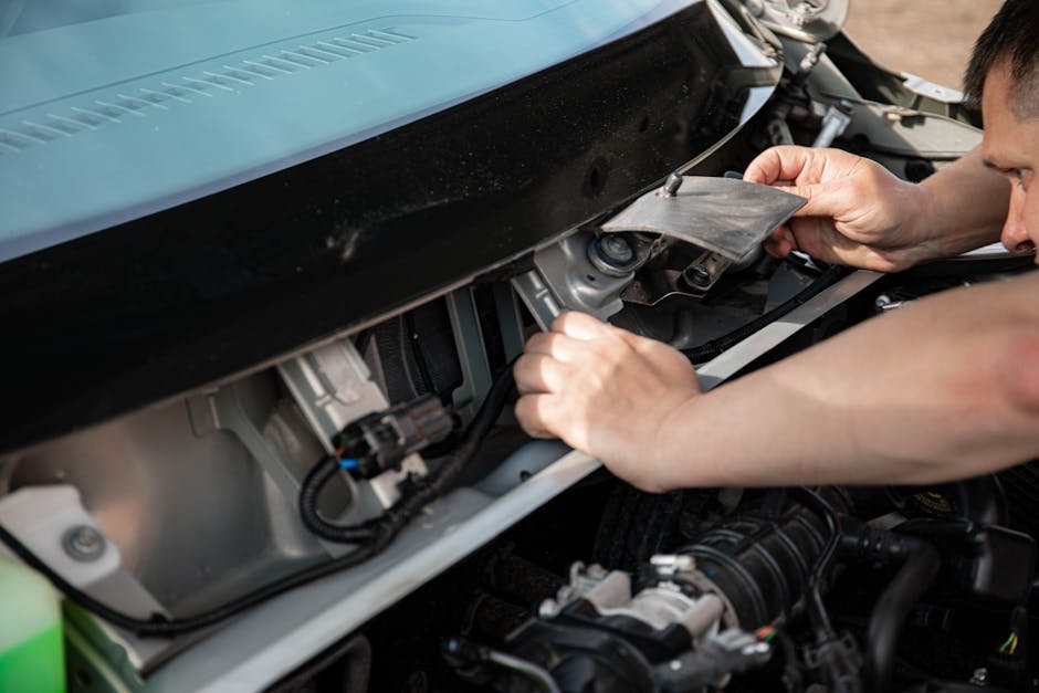 Mechanic installing quality auto parts