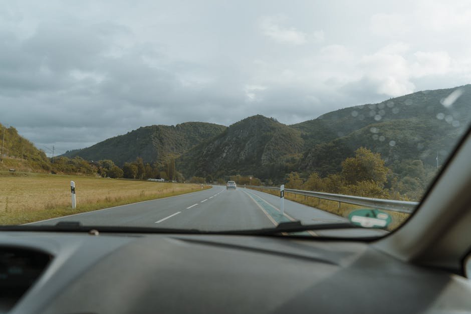Car driving on scenic highway for road trip