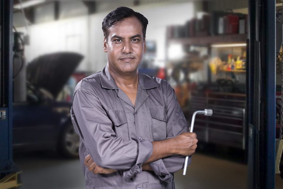Professional mechanic performing car repair service