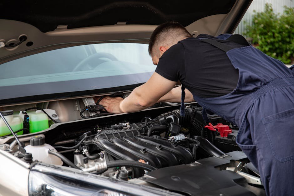 ASE certified mechanic at Norm's Auto Clinic working on foreign car
