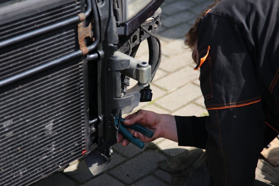New radiator being installed in vehicle