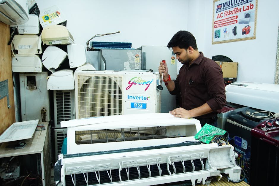 Mechanic recharging car air conditioning refrigerant