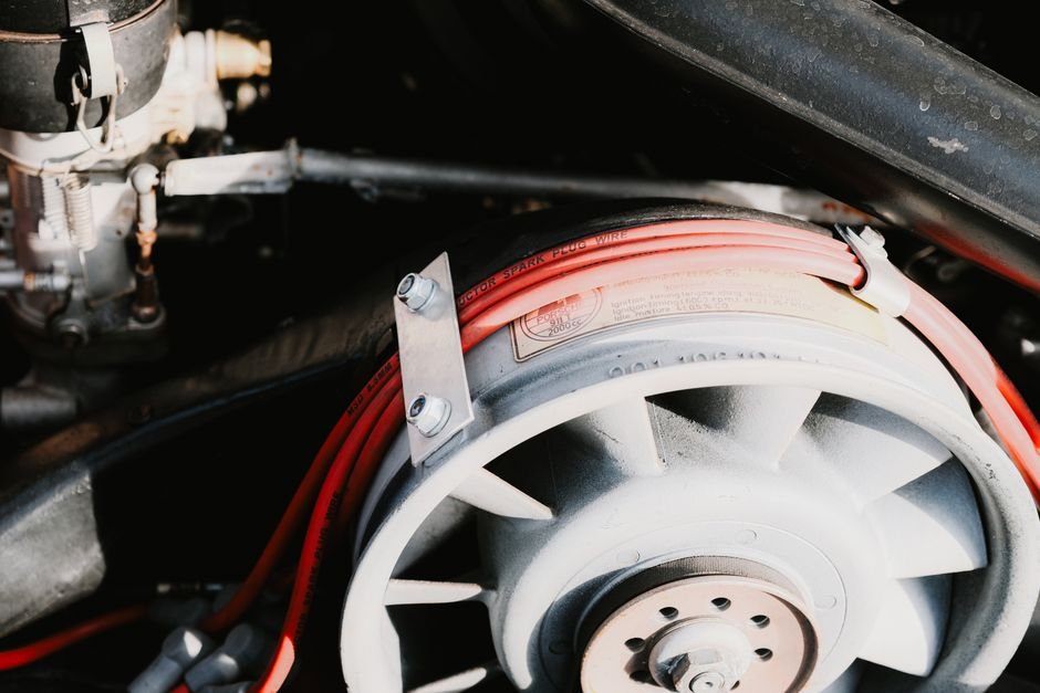 mechanic diagnosing car electrical system wiring