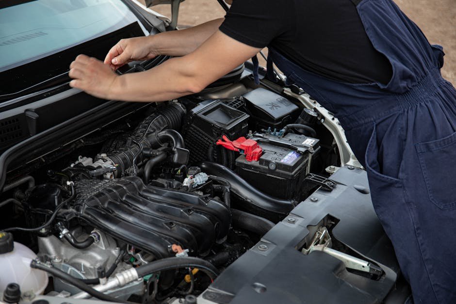 Mechanic servicing a minivan at Norm's Auto Clinic