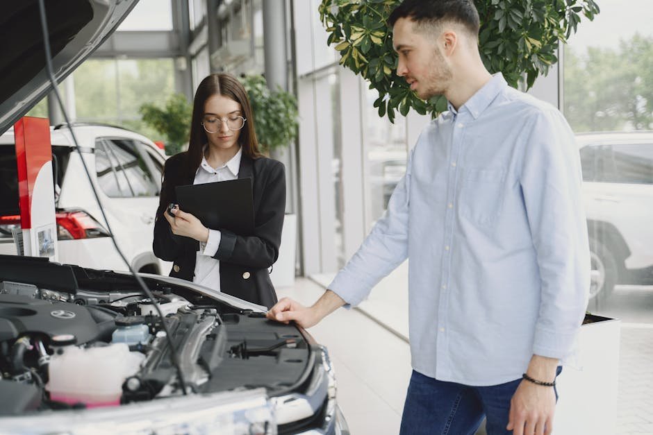 Service advisor discussing car repair options with customer