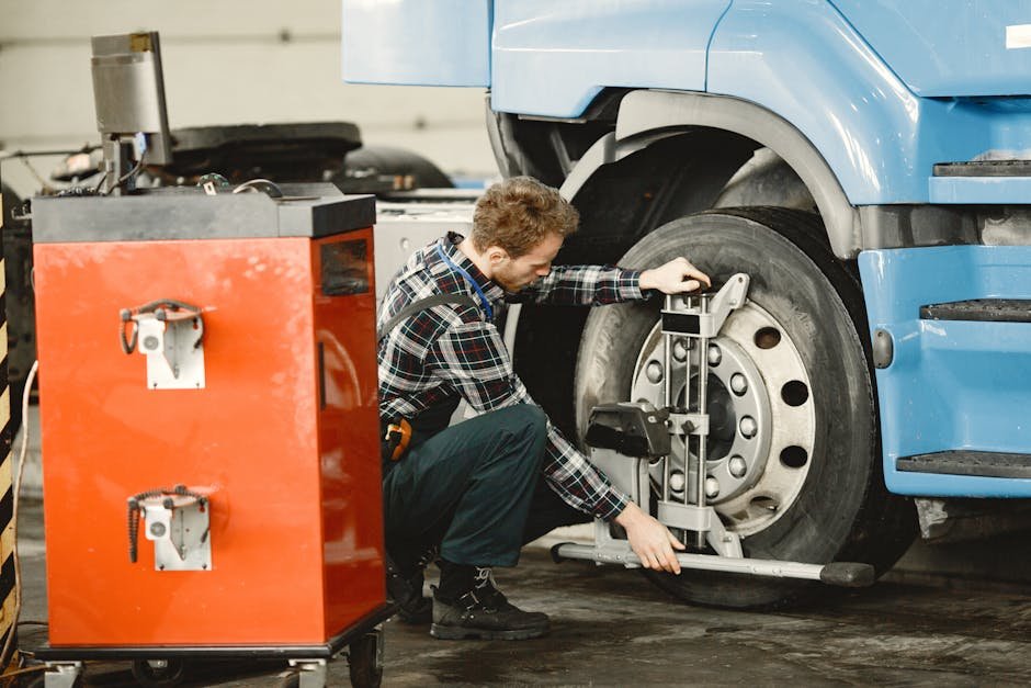 Mechanic inspecting Ford truck at auto shop
