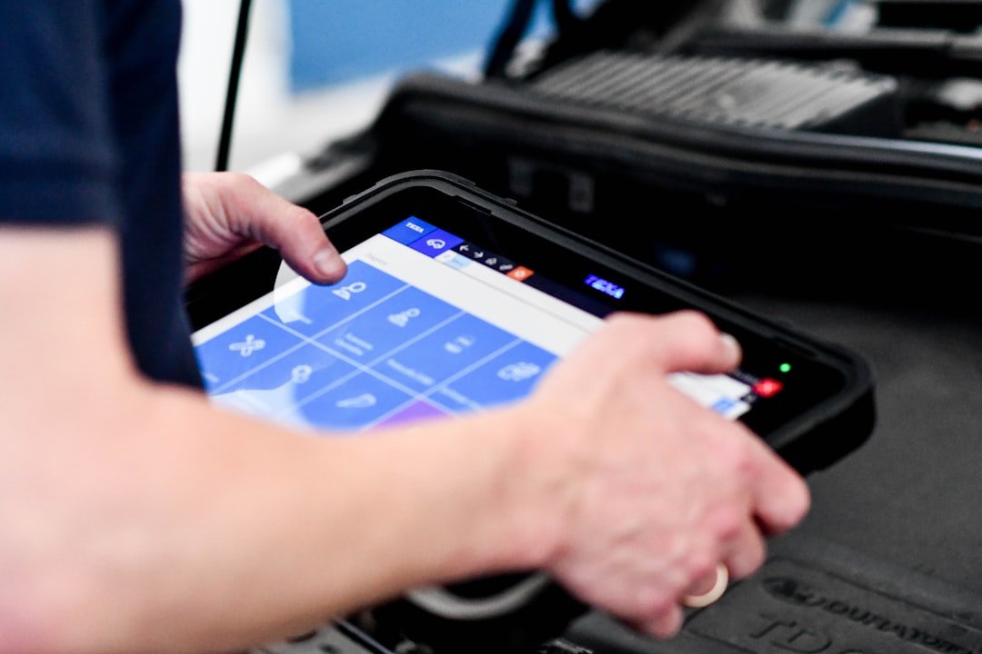 OBD-II diagnostic scanner tool used by mechanic