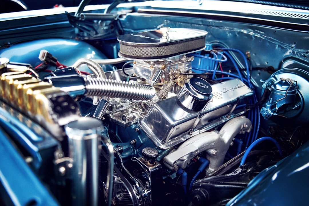 Fresh motor oil being poured into engine