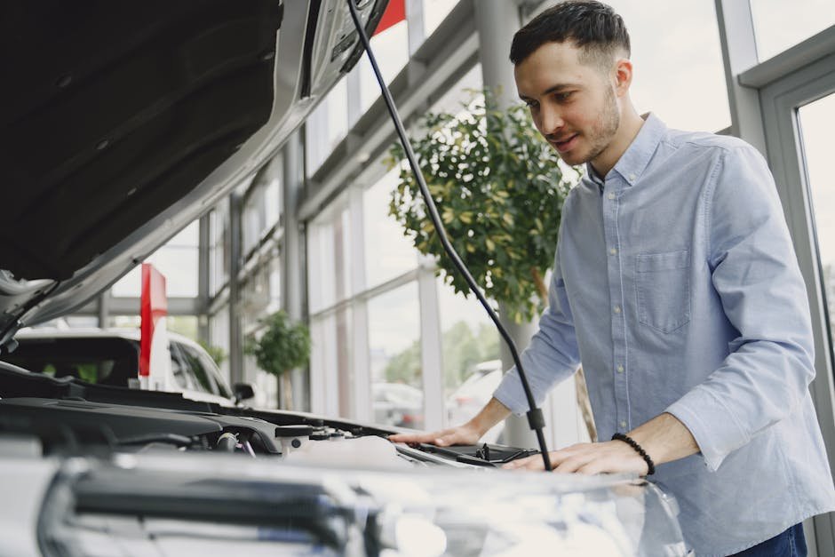 mechanic performing pre-sale vehicle inspection for seller