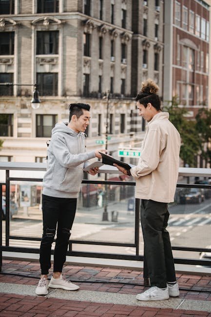 drivers exchanging insurance and contact information after car accident